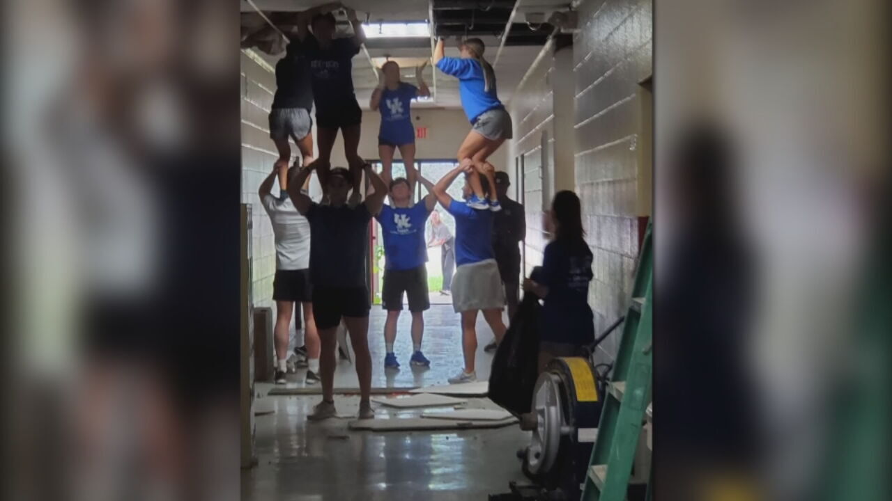 UK cheerleaders use their unique skills to help clean school in eastern Kentucky